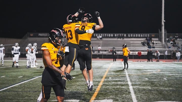 Mission Viejo players celebrate after a big play against Chaparral on Friday, September 27, 2024.