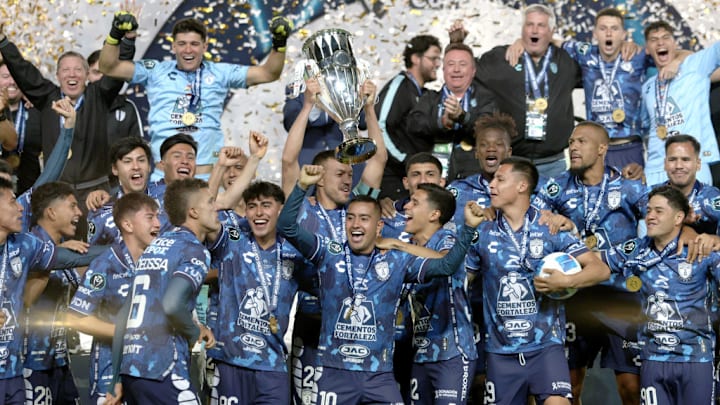 Gustavo Cabral #22 of Pachuca celebrating with his teammates...