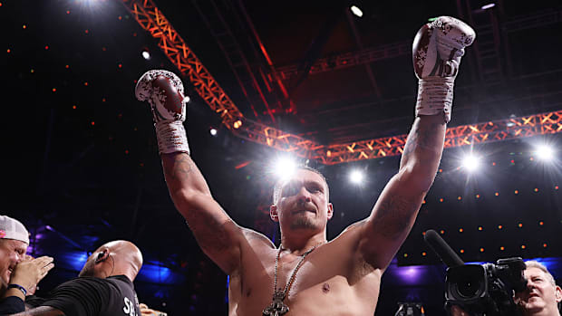 Heavyweight champion Oleksandr Usyk celebrates after defeating Daniel Dubois with a fifth-round knockout on July 19.