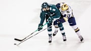 Michigan State defenseman Artyom Levshunov (5) and Notre Dame forward Trevor Janicke (27) battle for the puck during the Michigan State-Notre Dame NCAA hockey game on Friday, February 02, 2024, at Compton Family Ice Arena in South Bend, Indiana.
