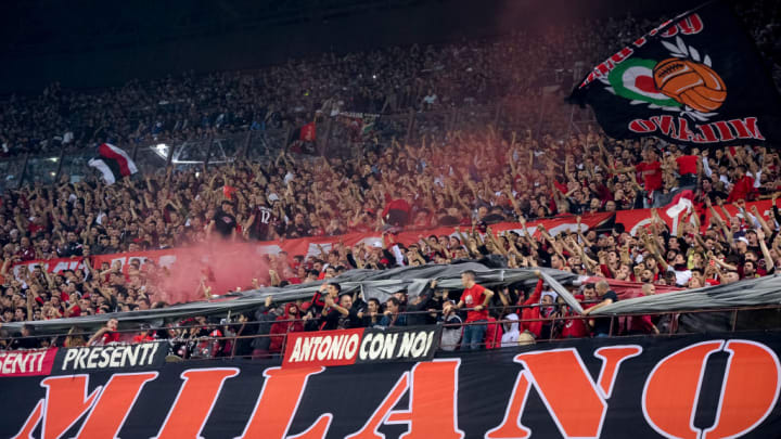 Fans of AC Milan show their support during the Serie A...