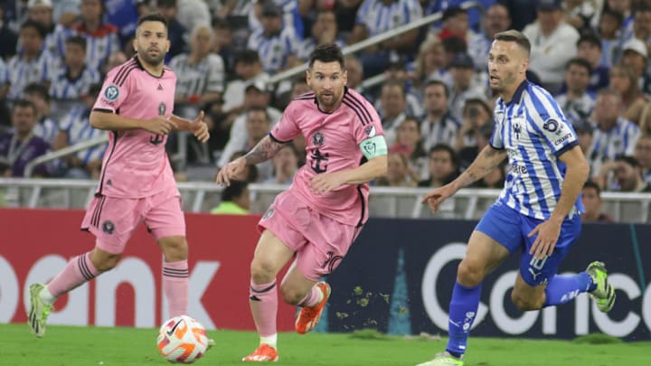 Lionel Messi #10 of Inter Miami and Sergio Canales #10 of...