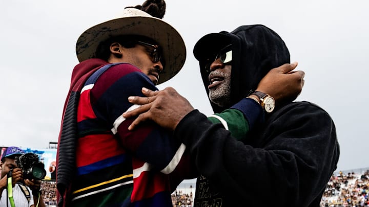 ORLANDO, FLORIDA - SEPTEMBER 28: Cam Newton and head coach Deion Sanders of the Colorado Buffaloes embrace prior to the game against the UCF Knights at FBC Mortgage Stadium on September 28, 2024 in Orlando, Florida. ORLANDO, FLORIDA - SEPTEMBER 28: Cam Newton and head coach Deion Sanders of the Colorado Buffaloes embrace prior to the game against the UCF Knights at FBC Mortgage Stadium on September 28, 2024 in Orlando, Florida.