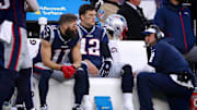 Patriots receiver Julian Edelman, quarterback Tom Brady and offensive coordinator Josh McDaniels can only watch from the bench as the Dolphins drive down the field in the final minutes of Sunday's game. 