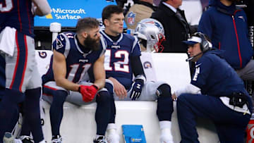 Patriots receiver Julian Edelman, quarterback Tom Brady and offensive coordinator Josh McDaniels can only watch from the bench as the Dolphins drive down the field in the final minutes of Sunday's game. 