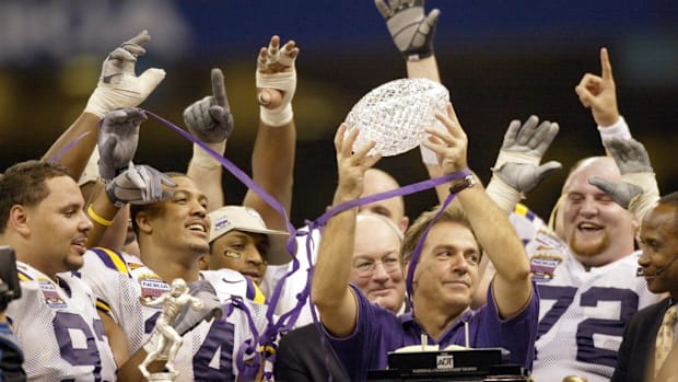 Nick Saban lifts the BCS National Championship Trophy 
