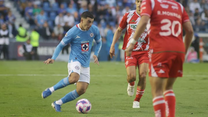Erik Lira #6 of  Cruz Azul drives the ball forward during...