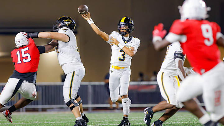 American Heritage quarterback Dia Bell throwing against Milton defense 
