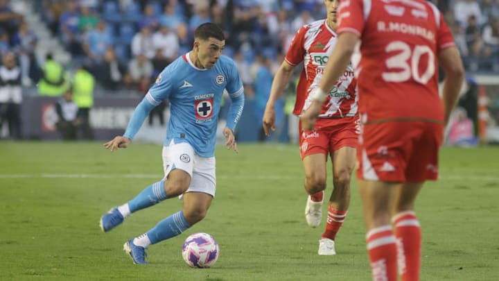 Erik Lira #6 of  Cruz Azul drives the ball forward during...