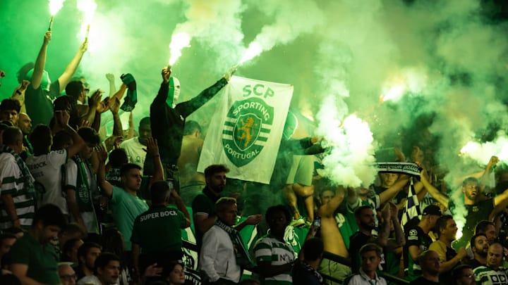 Sporting CP supporters hold torches during the Liga Portugal...