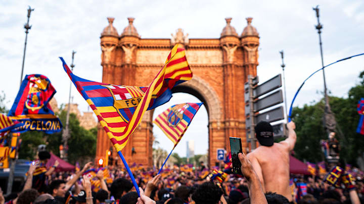 Fans seen holding FC Barcelona flags during the celebrations...