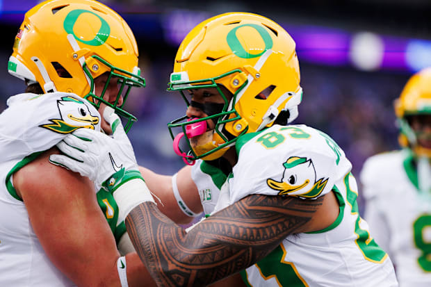 Oregon Ducks Washington Huskies uniforms nike phil knight husky stadium dan lanning NIL jedd fisch akili smith rivalry colleg