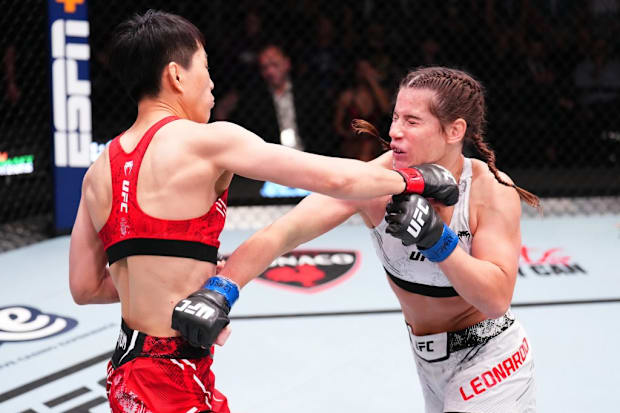 Cong Wang punches Victoria Leonardo during a women's flyweight fight.