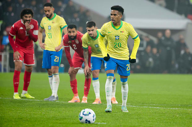Estêvão converts a penalty for Brazil against Tunisia.