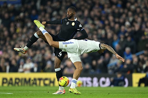 Tosin tangles with Leeds player Lukas Nmecha.
