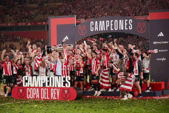 Athletic Club players celebrate their victory at the end of...