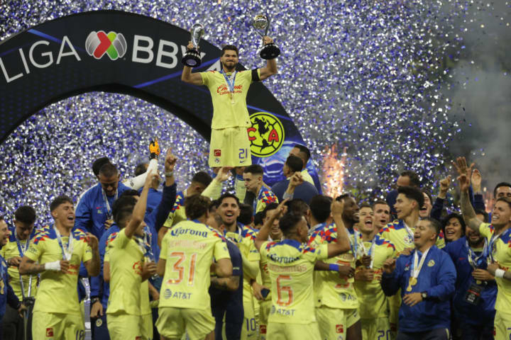 Henry Martín #21, of Club America lifts the Liga MX...