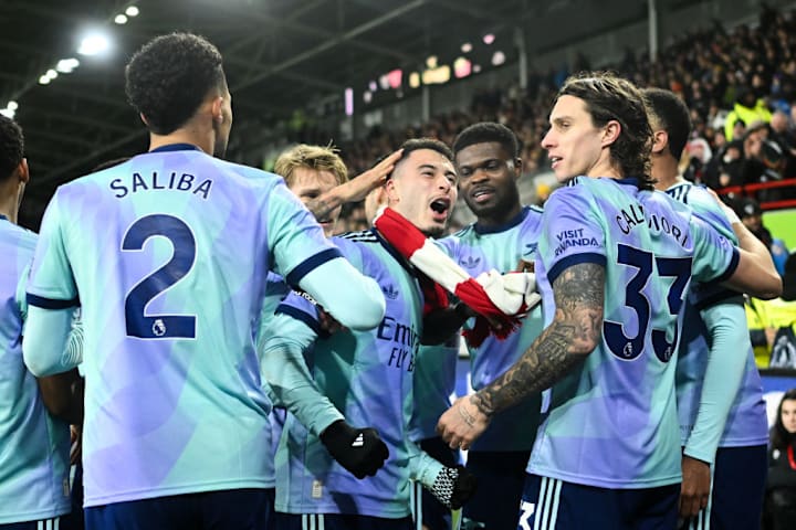 Arsenal players celebrate at Brentfor