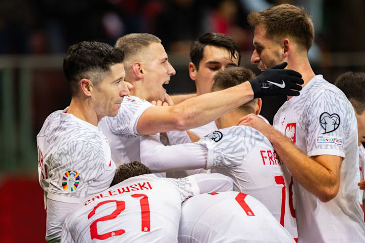 From L to R: Robert Lewandowski, Jakub Piotrowski,...