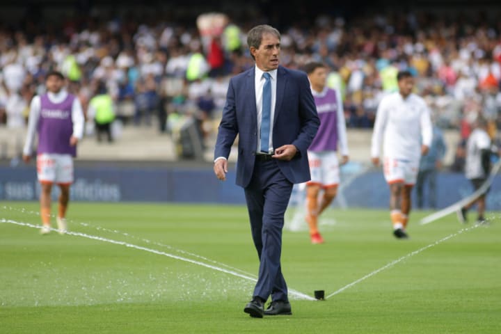 Head Coach of Pachuca, Guillermo Almada enters the field...