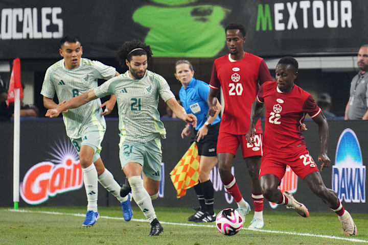 Cesar Huerta #21 of Mexico and Richie Laryea #22 of Canada...