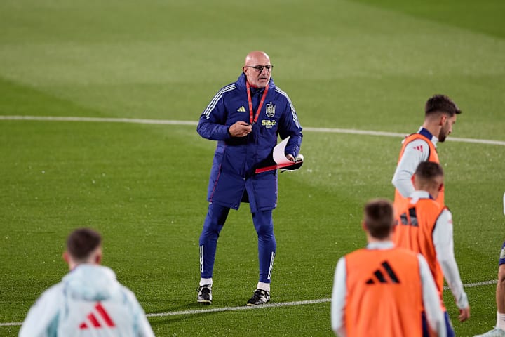 Luis de la Fuente, the head coach of Spain looks on during...