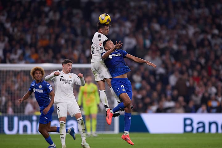 Raul Asencio (L) of Real Madrid CF and Alvaro Rodriguez (R)...