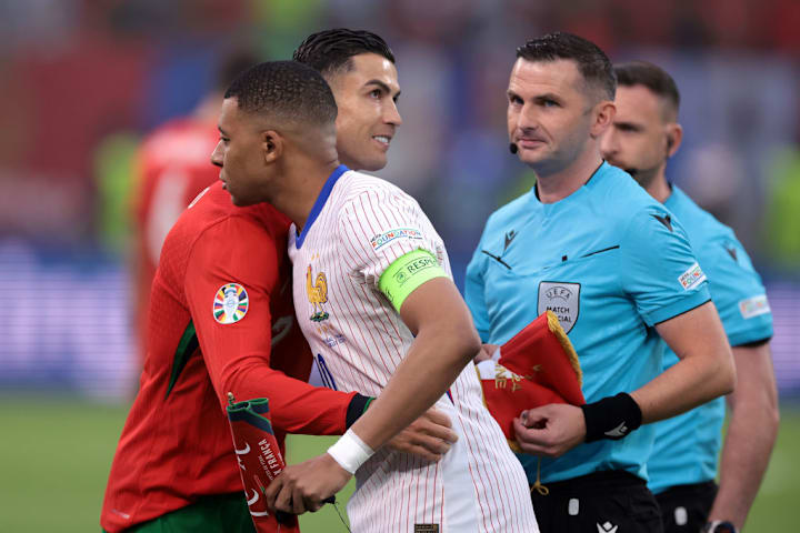 Cristiano Ronaldo, Kylian Mbappe, Michael Oliver
