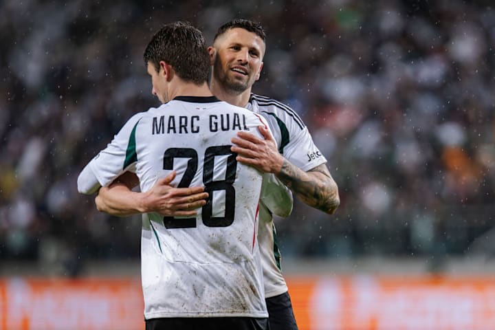 Marc Gual (L) and Pawel Wszolek (R) of Legia celebrate a...