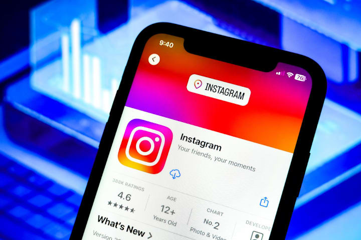 In this photo illustration, an Instagram app logo is...