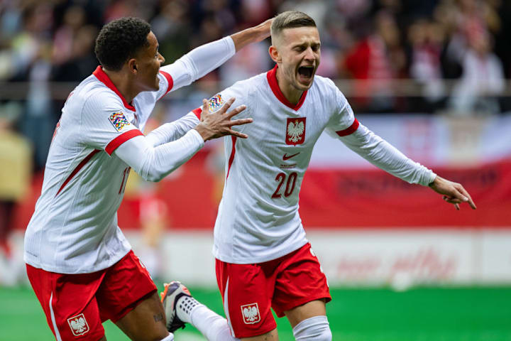 Michael Ameyaw (L) and Sebastian Szymanski (R) of Poland...
