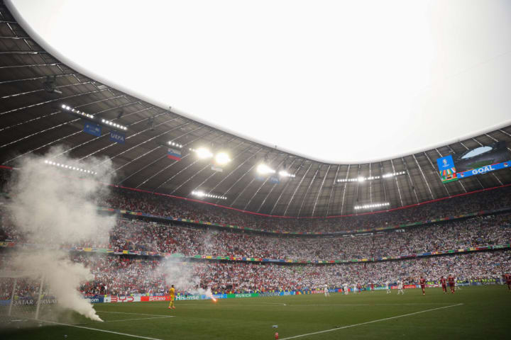 A view of a Munich Football Arena and pyrotechnics thrown by...