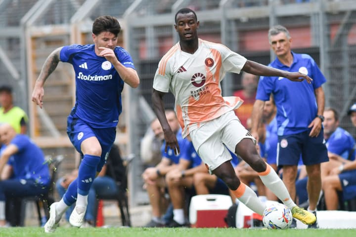 (L-R) Giulian Biancone of Olympiakos, and Evan Ndicka of AS...