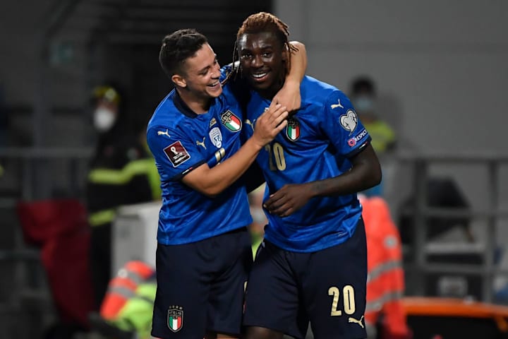 Giacomo Raspadori of Italy celebrates with Moise Kean after...