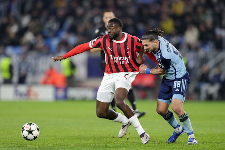 Youssouf Fofana of AC Milan (L) and Kyriakos Savvidis of Slovan Bratislava (R)