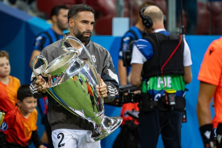 Dani Carvajal of Real holds UEFA Champions League trophy...