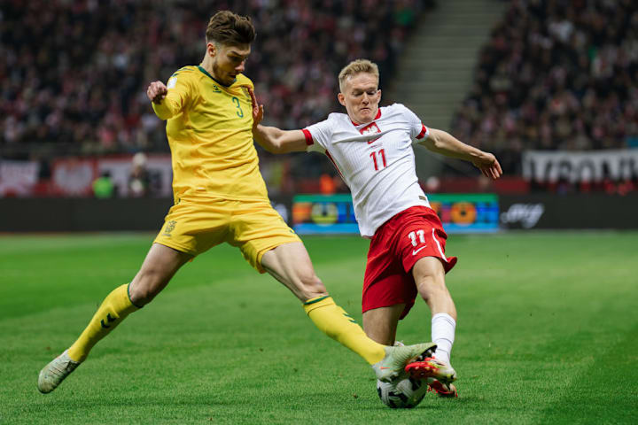 Edgaras Utkus (L) of Lithuania and Karol Swiderski (R) of...