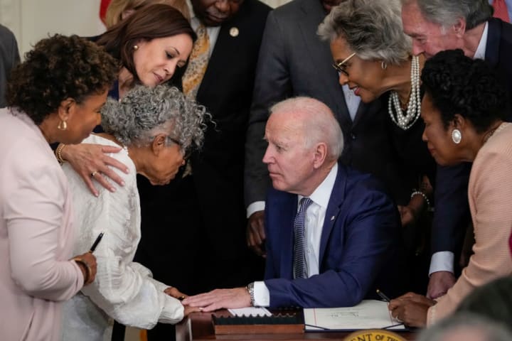 Opal Lee talks to Joe Biden on the day he signs the Juneteenth National Independence Day Act into law