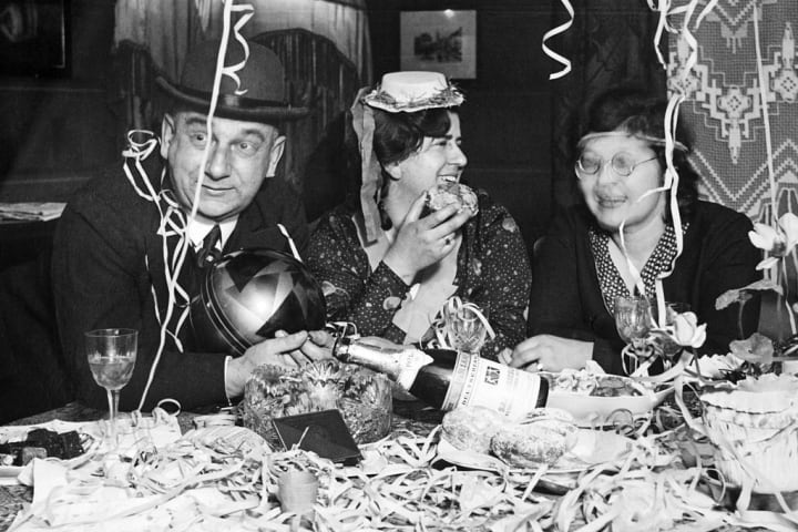 A trio enjoys a New Year's Eve party, ca. 1930