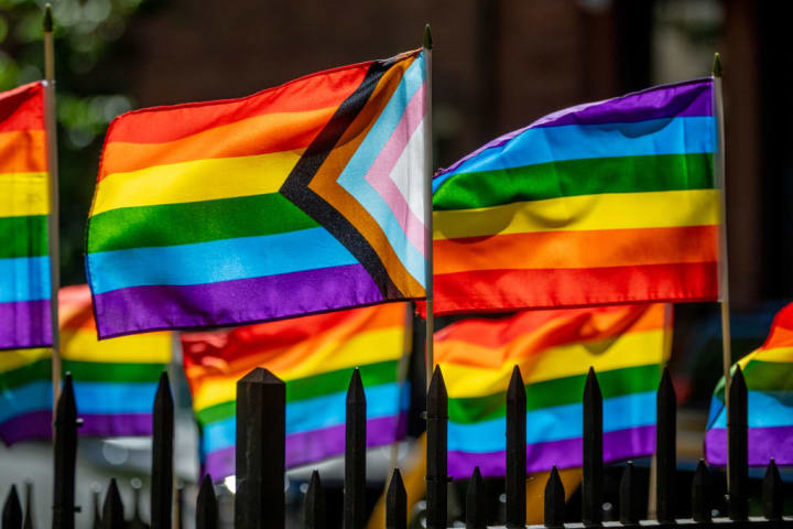 photo of LGBTQ+ flags outside Stonewall National Monument