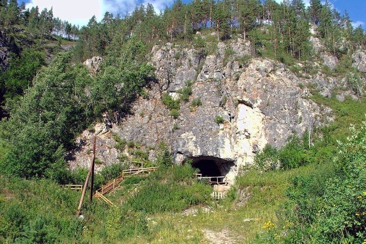 The entrance to Denisova Cave in Russia’s Altai Mountains.