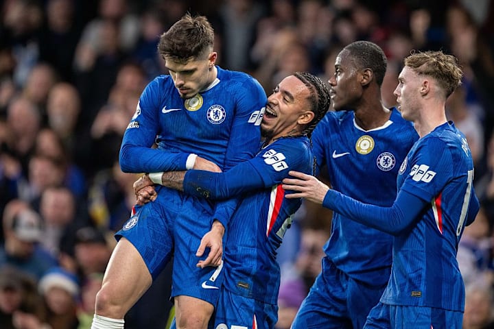 Pedro Neto is hoisted into the air by Malo Gusto