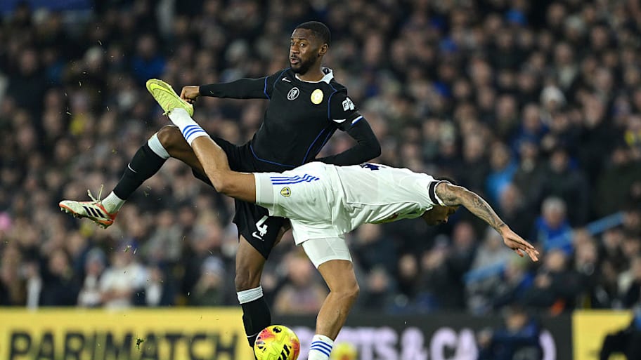 Tosin tangles with Leeds player Lukas Nmecha.
