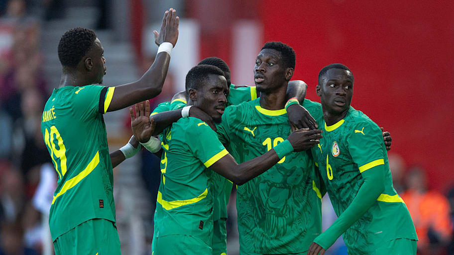 Senegal celebrate scoring against England