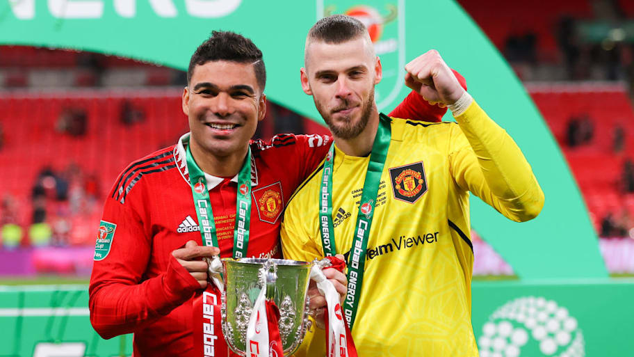 Casemiro, David de Gea hold the Carabao Cup, 2023.