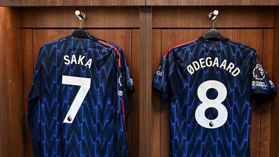 Bukayo Saka, Martin Ødegaard shirts hung up.