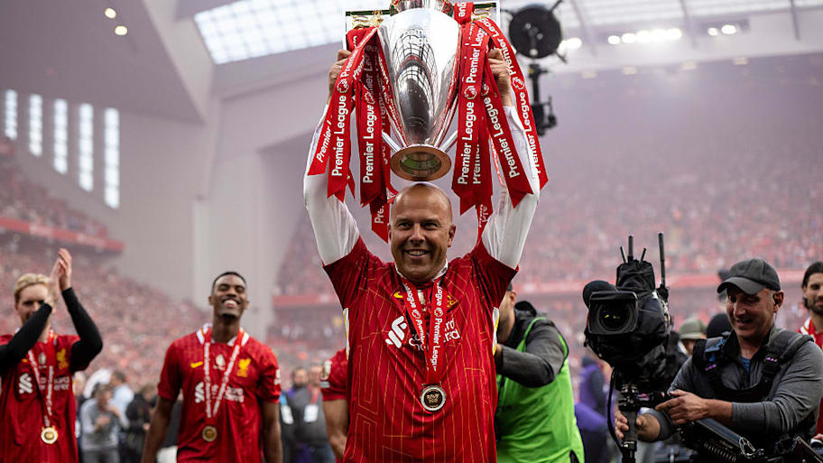 Arne Slot lifts the Premier League trophy.