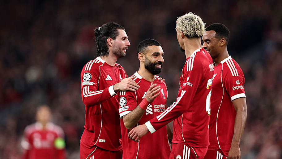 Mohamed Salah celebrates with Liverpool teammates