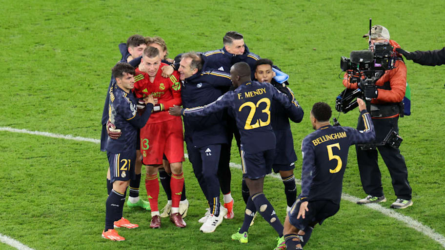 Andriy Lunin mobbed by his joyous teammates.