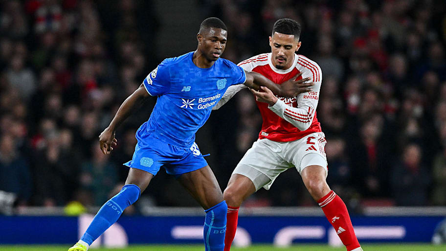 Christian Kofane holds off William Saliba